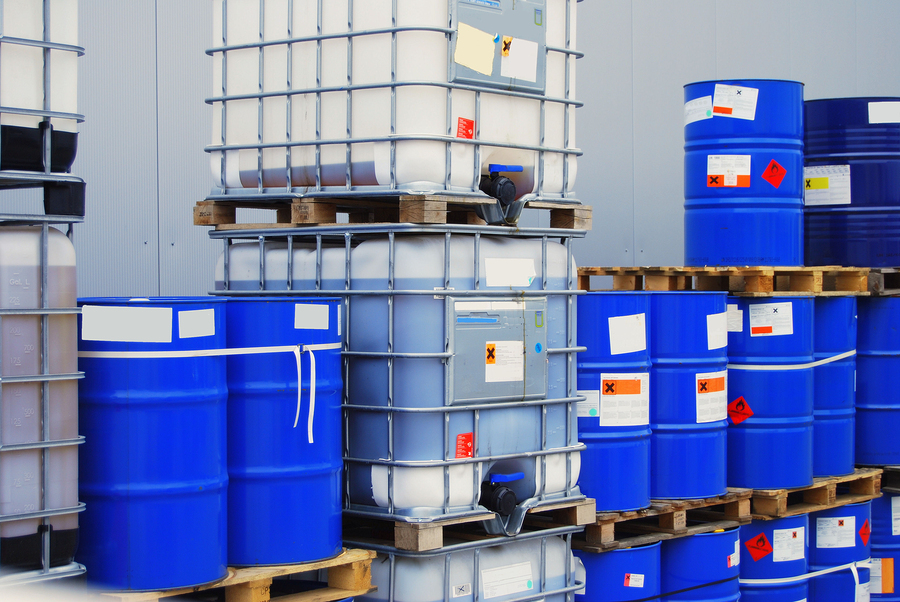 Multiple totes of various hazmat liquids